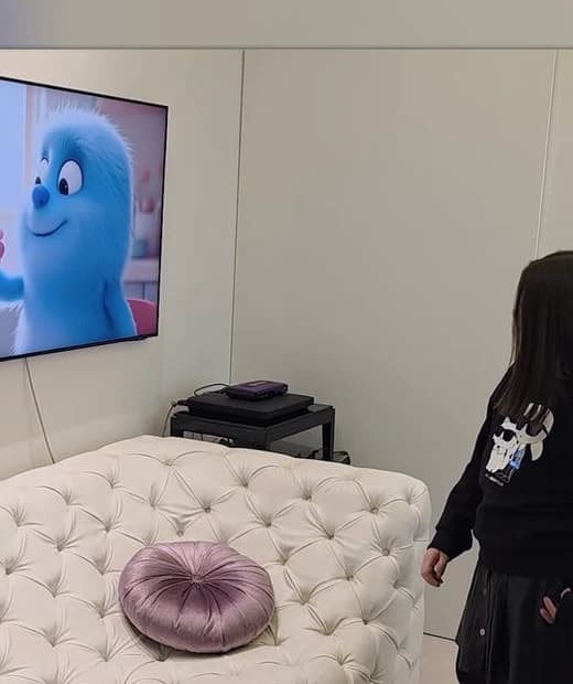 A child enjoying an animated story at home